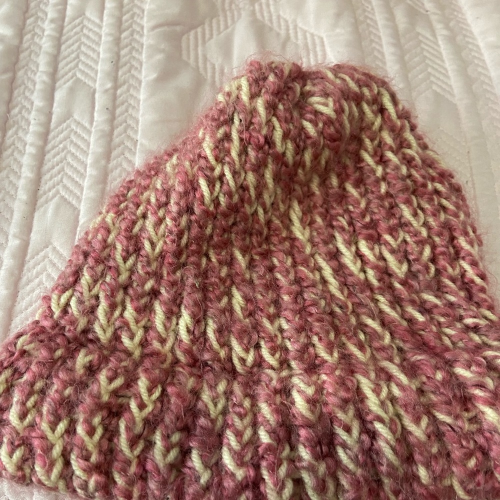 Knitted pink and white hat